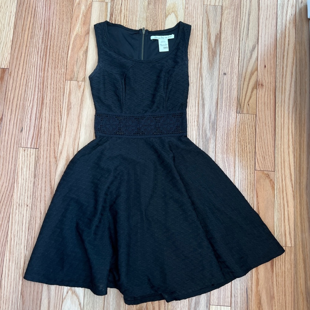 Black dress with lacing in the middle